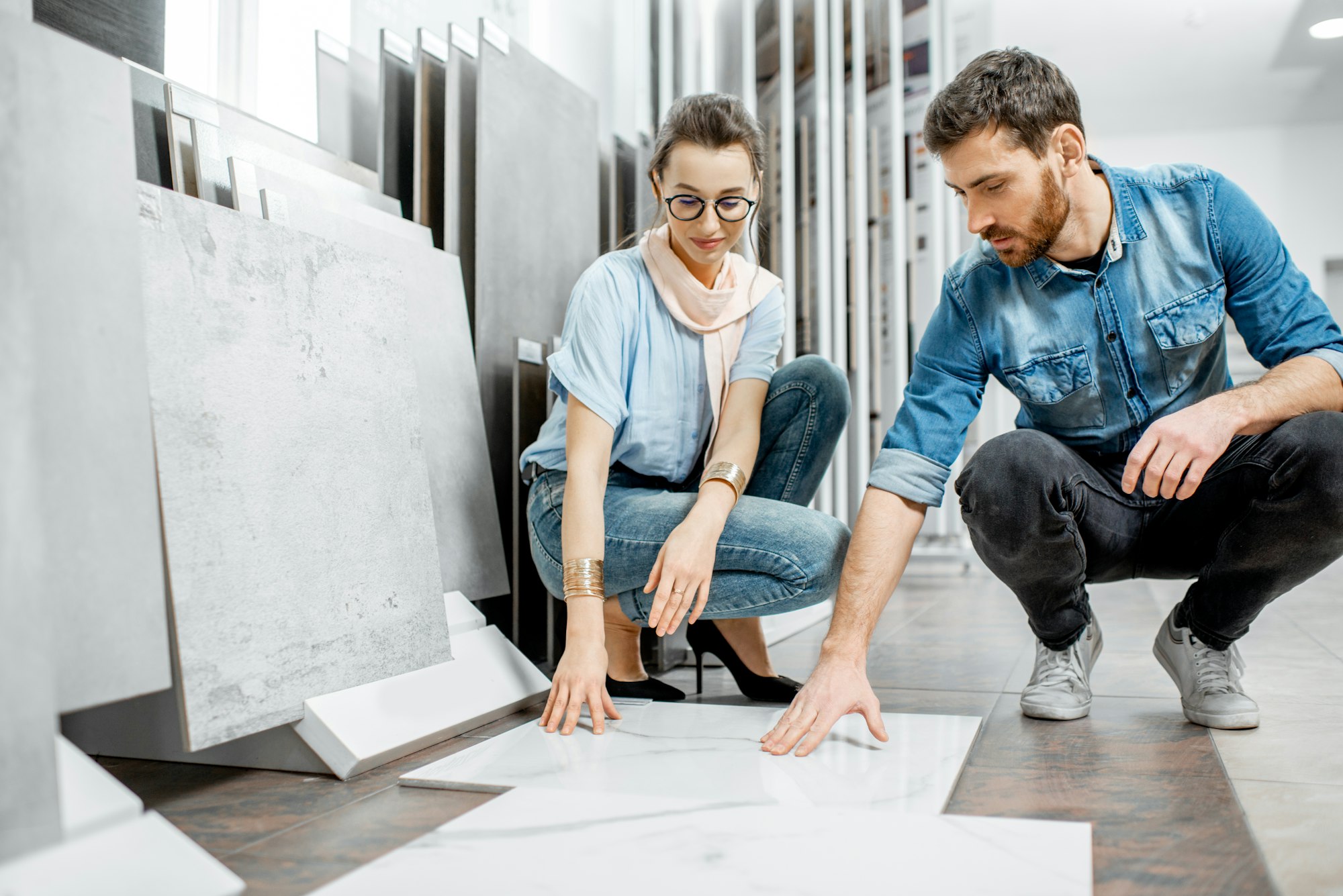 Couple choosing tiles in the shop